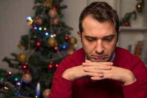 Man felling depressed and lonely during the holidays